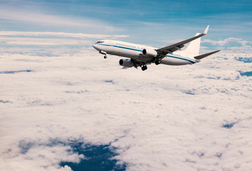 Fototapeta na wymiar Planes soaring in the clouds.