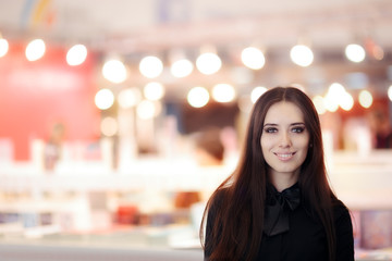Smiling Elegant Woman Wearing  Black Shirt and Bowtie Standing Indoors 