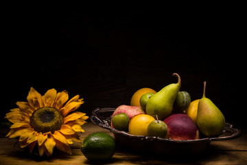 summer fruits with sunflower in light painting