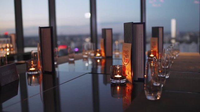 Modern restaurant, view of glasse goblets on the tabel, shallow depth of field. Interior lighting.
