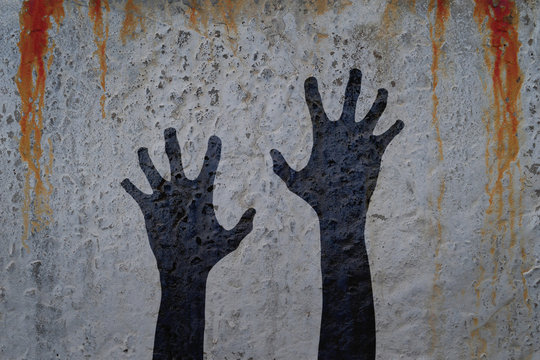 Two corpse hands silhouette in shadow on bloody wall background. Halloween and zombie theme illustration.