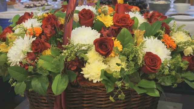 Big beautiful basket of flowers is on the anniversary. Close-up