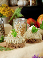 Canape with meat, fish or vegetable pate surrounded by village style attributes