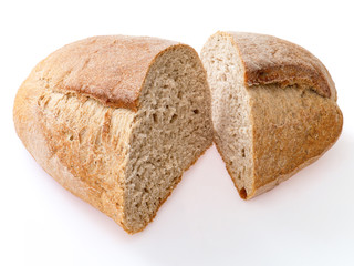 Loaf of rye bread cut in two pieces. Close up, on white