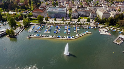 Fototapeta na wymiar Fountain And Luxury Marina Boats In Zurich Switzerland Aerial View