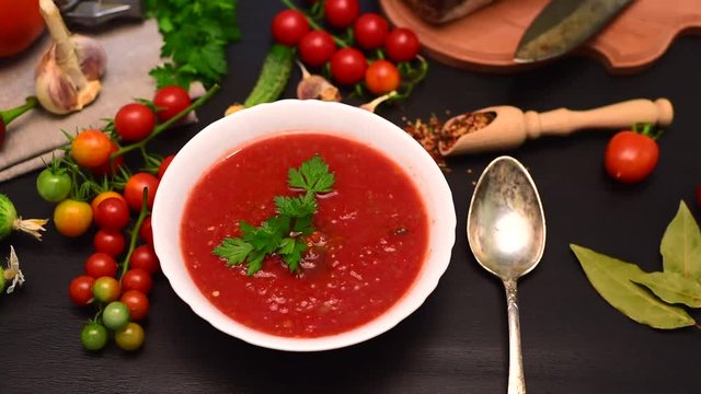 Cold soup of tomato gazpacho in a white plate