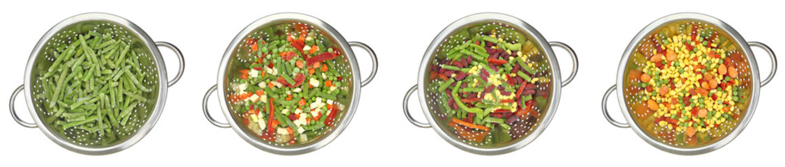 Variety of frozen vegetables in colanders - white background