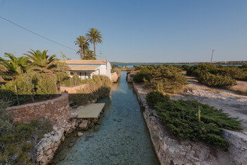 House on the aqueduct to the salt flats of the island of Formentera. Spain