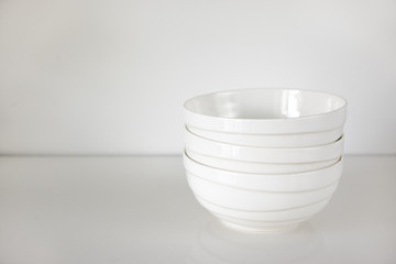 three bowls on the white dining table