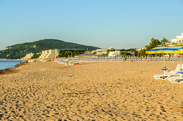 The Black Sea shore from Albena, Bulgaria with golden sands, blue fresh water, sunbeds and...