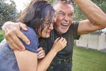 Man and womman while downpour