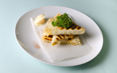 Quesadilla with chicken and cheddar cheese with sauce