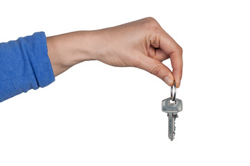 Woman hand holding home keys isolated on white background with copy space