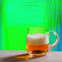 Glass of Beer on the Green Background