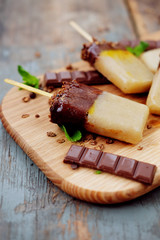 Homemade ice cream. Chocolate banana granola popsicles.