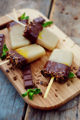 Homemade ice cream. Chocolate banana granola popsicles.