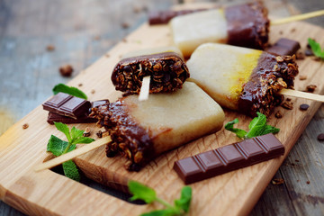 Homemade ice cream. Chocolate banana granola popsicles.