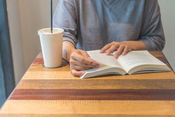 Reading book and having coffee in the morning