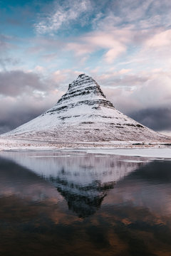 Scenic view of Kirkjufell mountain against cloudy sky