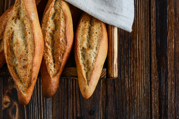 Homemade bread on a wooden background.