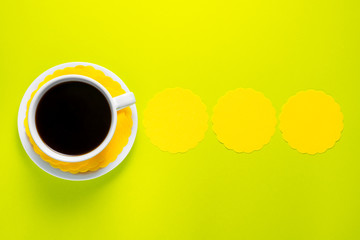 Cup of coffee on colorful background
