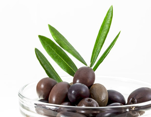 Cup with olives, twig, olive branch
