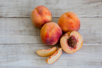 Fototapeta na wymiar Fresh peaches, Peach close up fruit background, peach on wood background,sweet peaches, group of peaches,sliced peaches, peach slices
