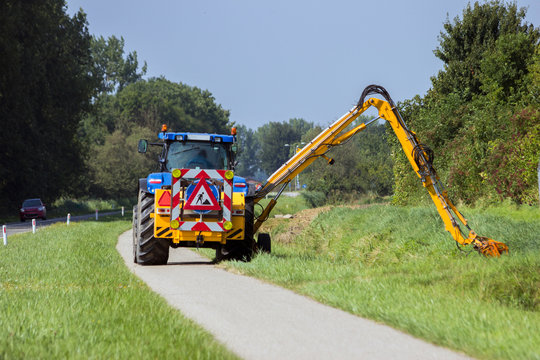 Tractor Mowing Roadside Shoulder