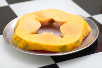 Fresh ripe papaya cut on the table