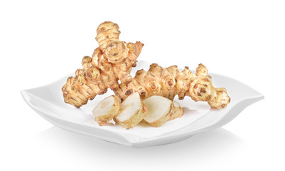 Jerusalem artichoke in plate (beautiful shape) on white background