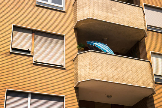 hot weather in the city, a beach umbrella in a terrace to stay out of the sun