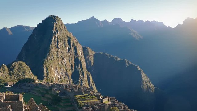 Pan From Sun Rise To Ancient Ruins On Mountainside