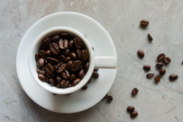 White Cup Filled With a Brown Coffee Beans