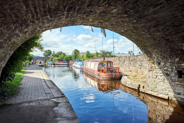 A boat on Brecon canal basin Powys Wales UK - Powered by Adobe