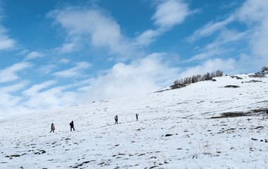 A team climb a snow mountain