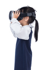 Asian little Chinese girl experiencing virtual reality via VR goggles