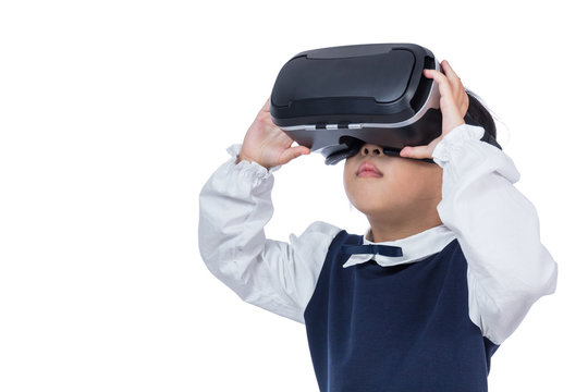 Asian little Chinese girl experiencing virtual reality via VR goggles