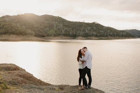 Lovers Laughing in front of Lake