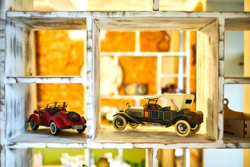 Vintage car toy standing on the shelf jpg