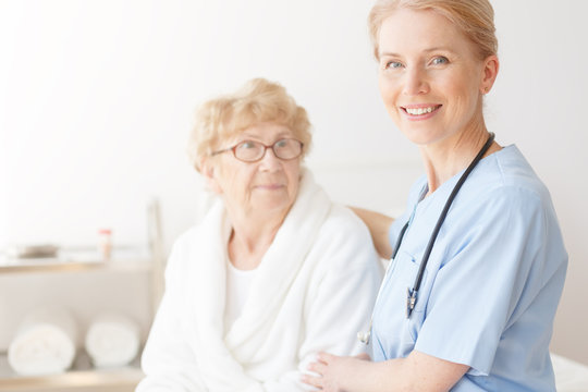 Senior lady in home with nurse