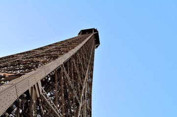 Detail of the top of the Eiffel tower view from the second floor.