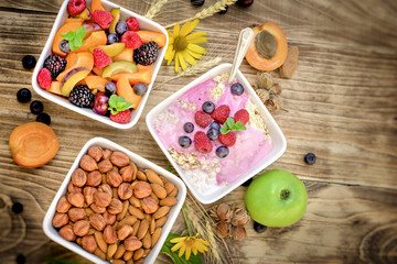 Obraz na płótnie Canvas Oatmeal with fruits and yogurt and fruit salad - healthy eating healthy food