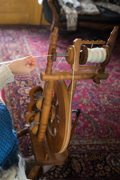 Woman using old fashioned loom