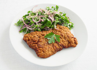 breaded beef with parsley onion salad