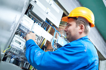 Electrician installing energy saving meter