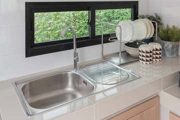 modern kitchen room with sink on counter