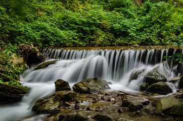 Obraz premium Landscape of waterfall Shypit in the Ukrainian Carpathian Mountains on the long exposure