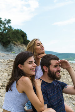 Young People Posing On Beach