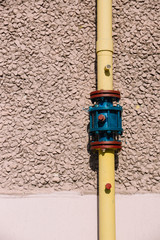 Colorful pipe on the wall. Natural