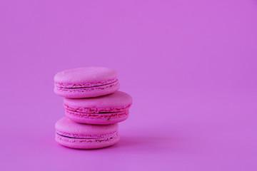Macaroons on pink paper backround